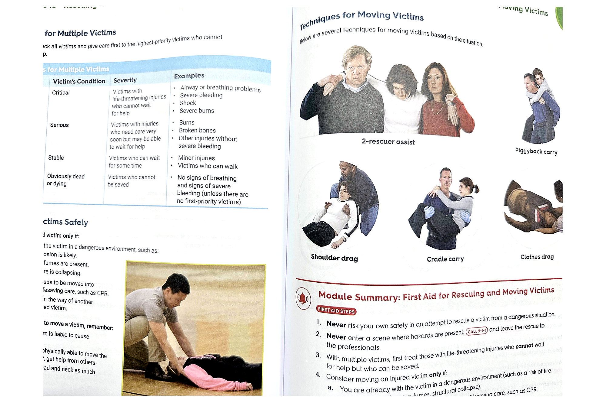 NSC First Aid, CPR and AED Student Workbook open to rescuing and moving victims first aid techniques.